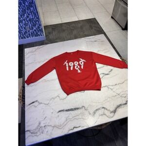 Medium sweatshirt features graphics inspired by Taylor Swift's re-recorded album